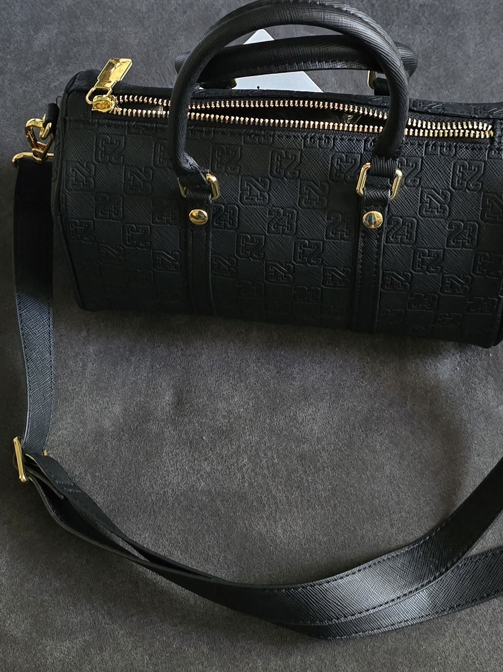 A black Jordan Monogram Mini Duffle Bag With Jump Man On It - Picture 3 of 10